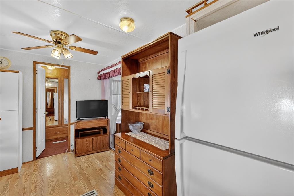 11324 Goldfinch Way Leesburg, FL 34788 - Photo 12 of 20 a view of a livingroom with wooden floor