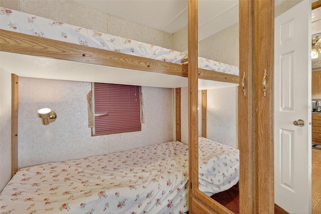 11324 Goldfinch Way Leesburg, FL 34788 - Photo 16 of 20 a view of a bedroom