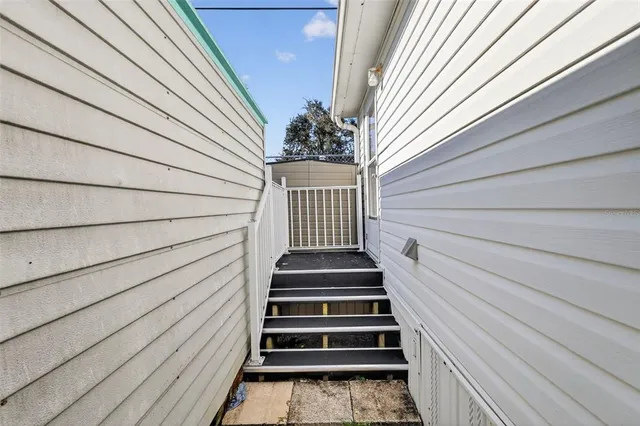 a view of entryway with wooden floor and stairs