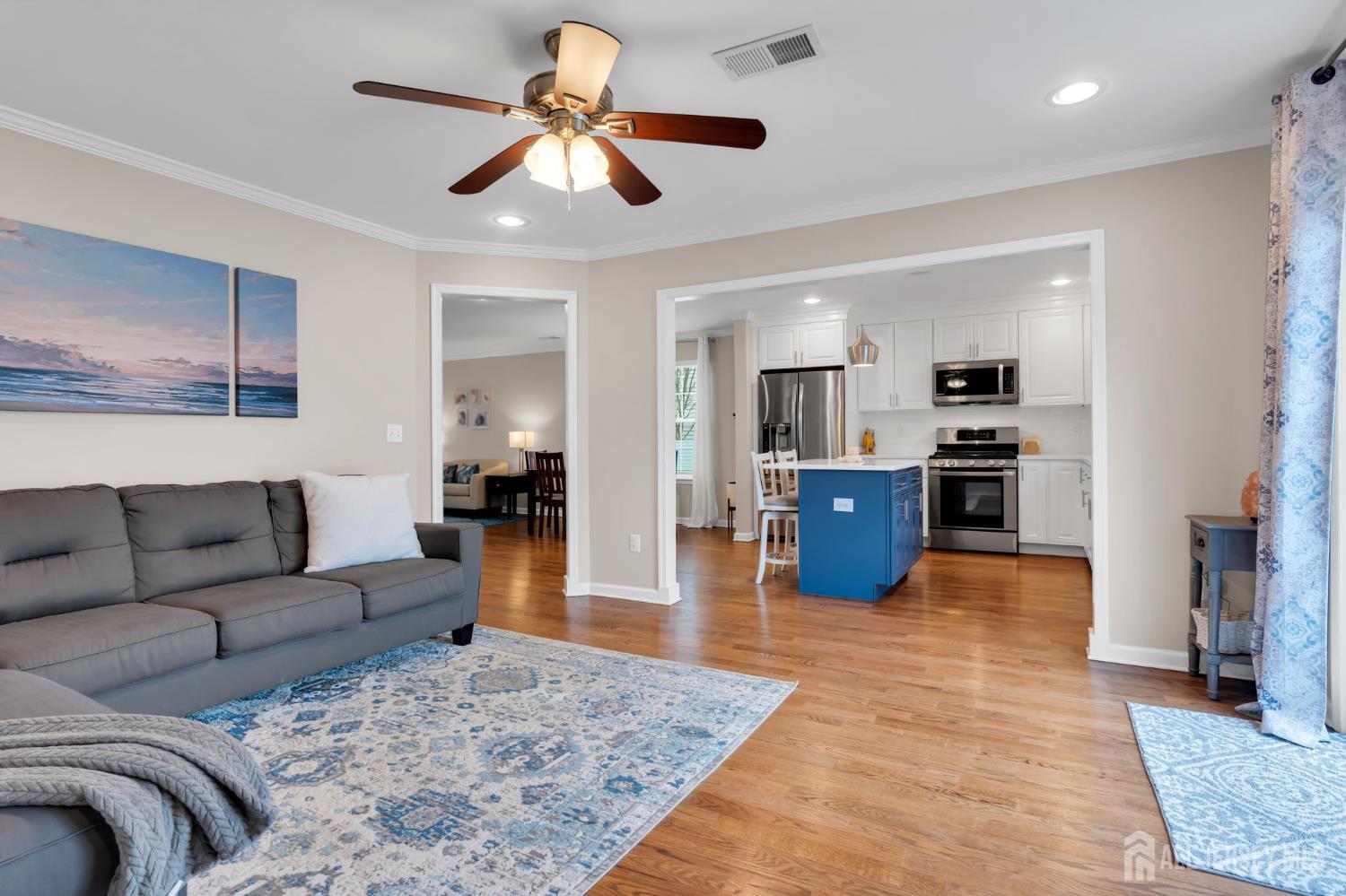 3 Harrison Avenue Aberdeen, NJ 07747 - Photo 18 of 46 a living room with furniture and kitchen view