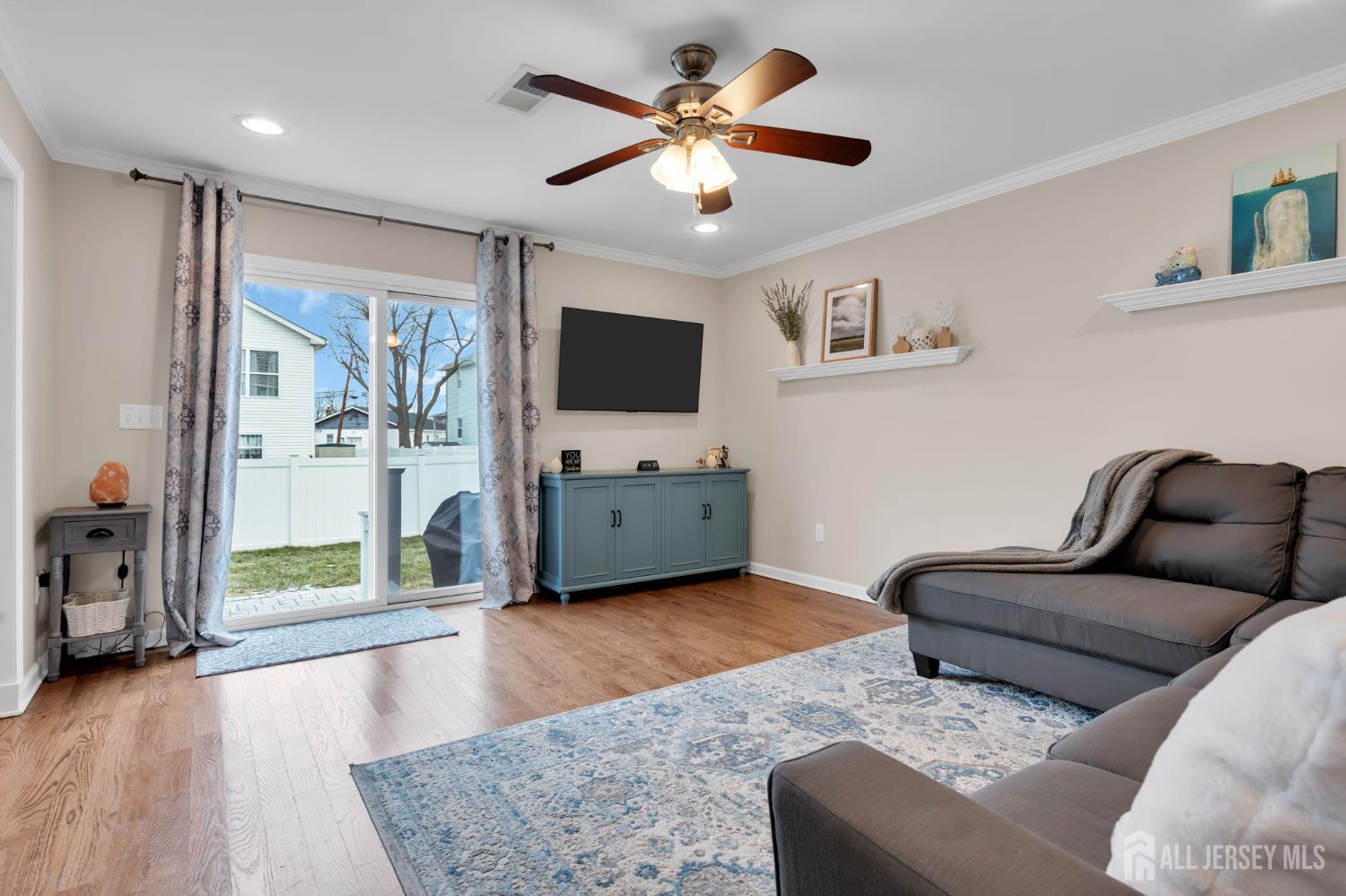 3 Harrison Avenue Aberdeen, NJ 07747 - Photo 20 of 46 a living room with furniture and a flat screen tv