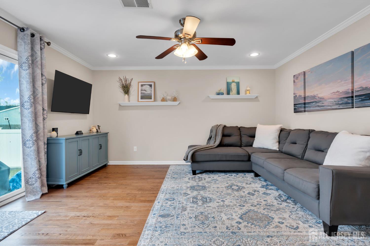 3 Harrison Avenue Aberdeen, NJ 07747 - Photo 21 of 46 a living room with furniture and a flat screen tv