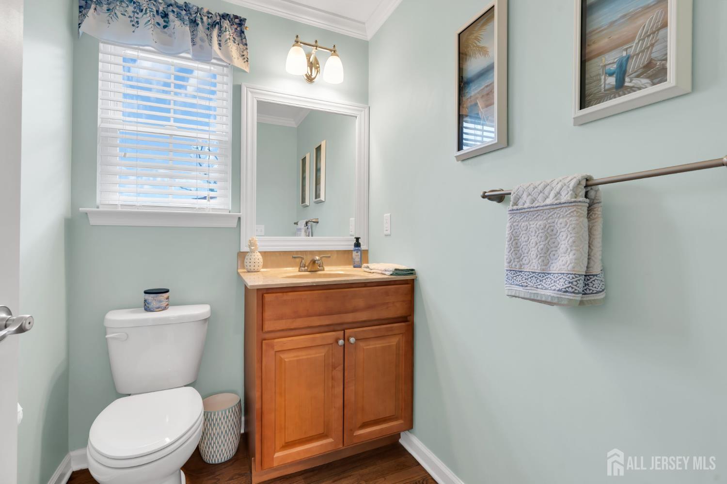 3 Harrison Avenue Aberdeen, NJ 07747 - Photo 22 of 46 a bathroom with a toilet a sink and mirror