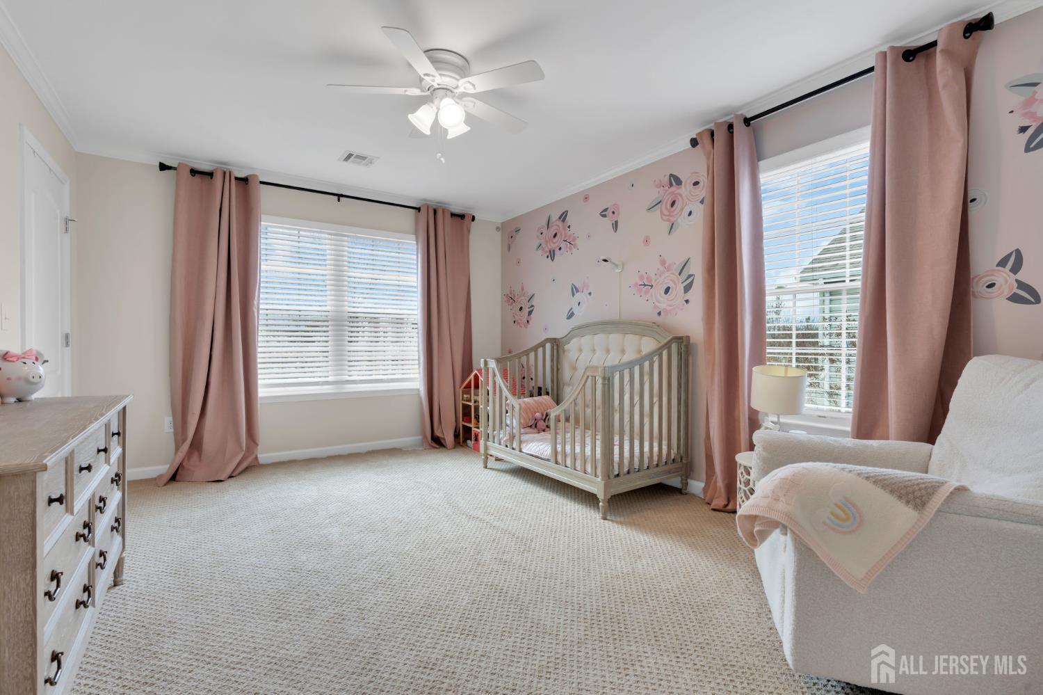 3 Harrison Avenue Aberdeen, NJ 07747 - Photo 23 of 46 a spacious bedroom with a bed and a window