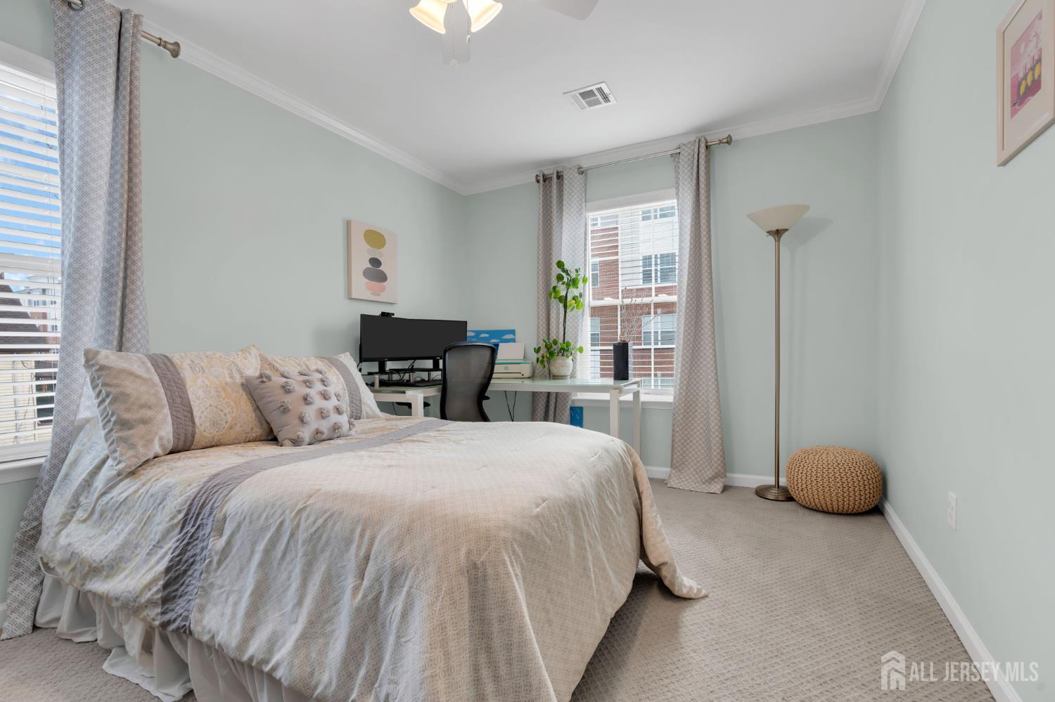 3 Harrison Avenue Aberdeen, NJ 07747 - Photo 24 of 46 a bedroom with a large bed and a window