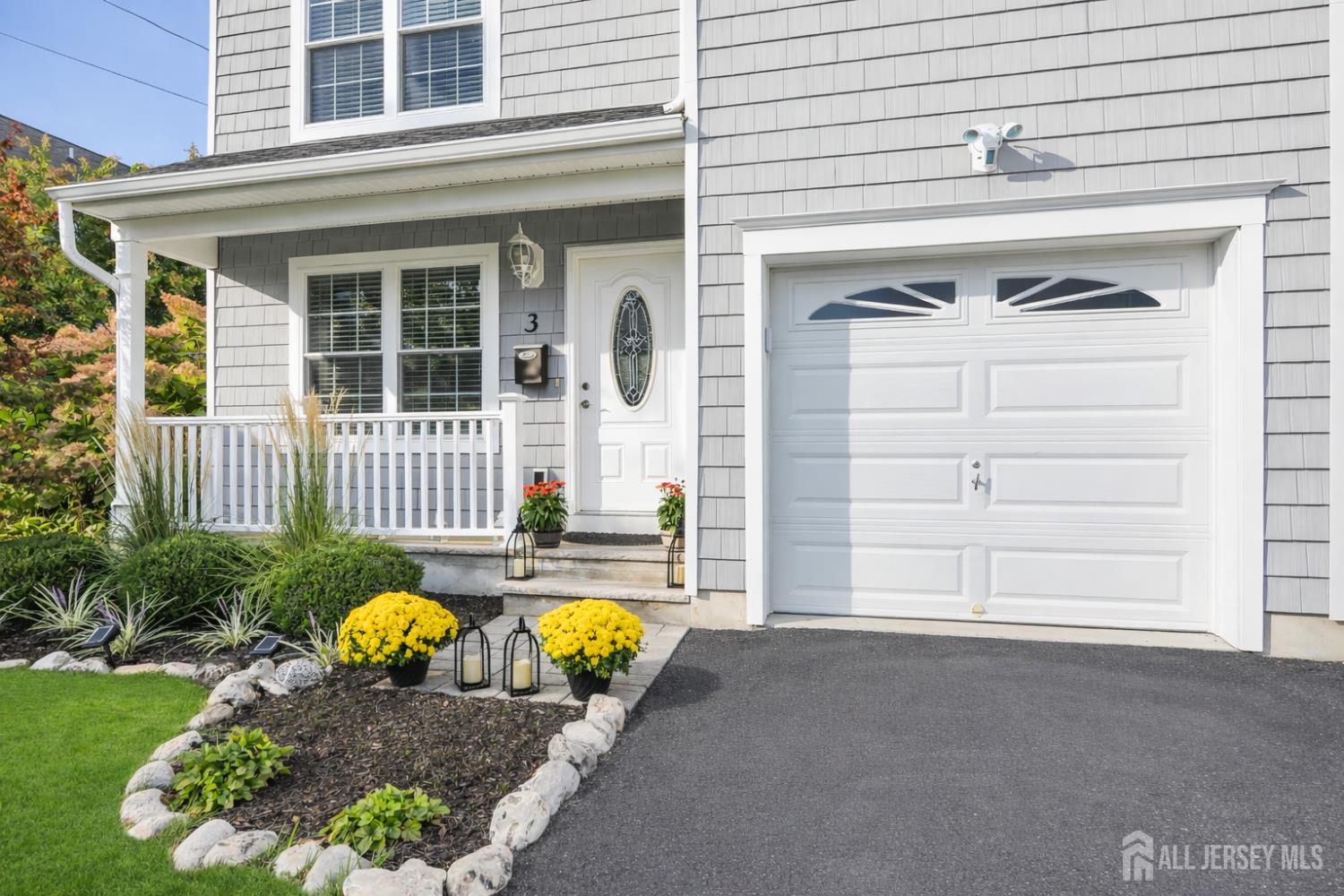 3 Harrison Avenue Aberdeen, NJ 07747 - Photo 3 of 46 a front view of a house with garden
