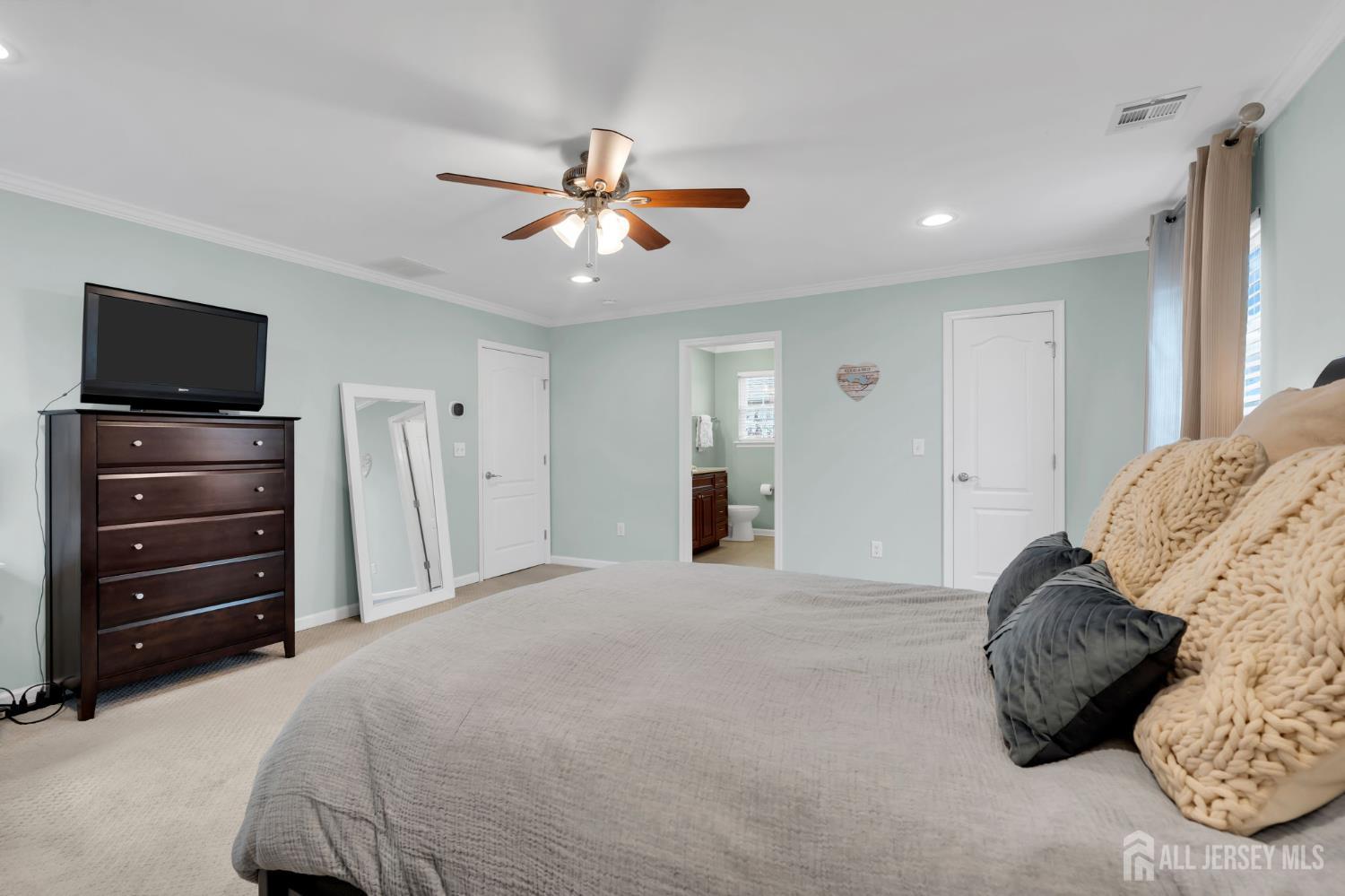 3 Harrison Avenue Aberdeen, NJ 07747 - Photo 31 of 46 a bedroom with a bed and a television
