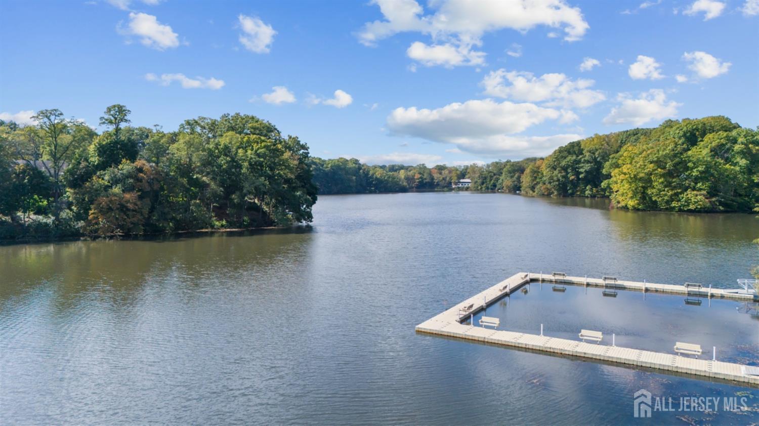 3 Harrison Avenue Aberdeen, NJ 07747 - Photo 46 of 46 a view of a lake with a yard and mountain view in back