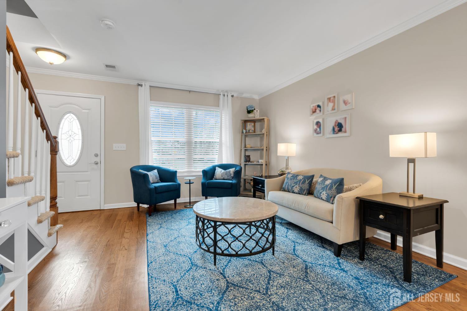 3 Harrison Avenue Aberdeen, NJ 07747 - Photo 6 of 46 a living room with furniture and a large window