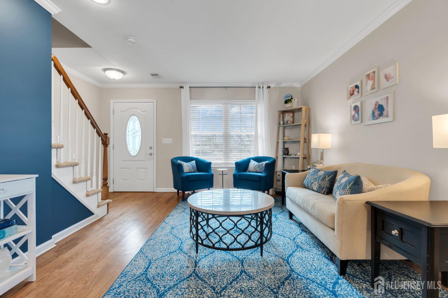 3 Harrison Avenue Aberdeen, NJ 07747 - Photo 7 of 46 a living room with furniture and a wooden floor
