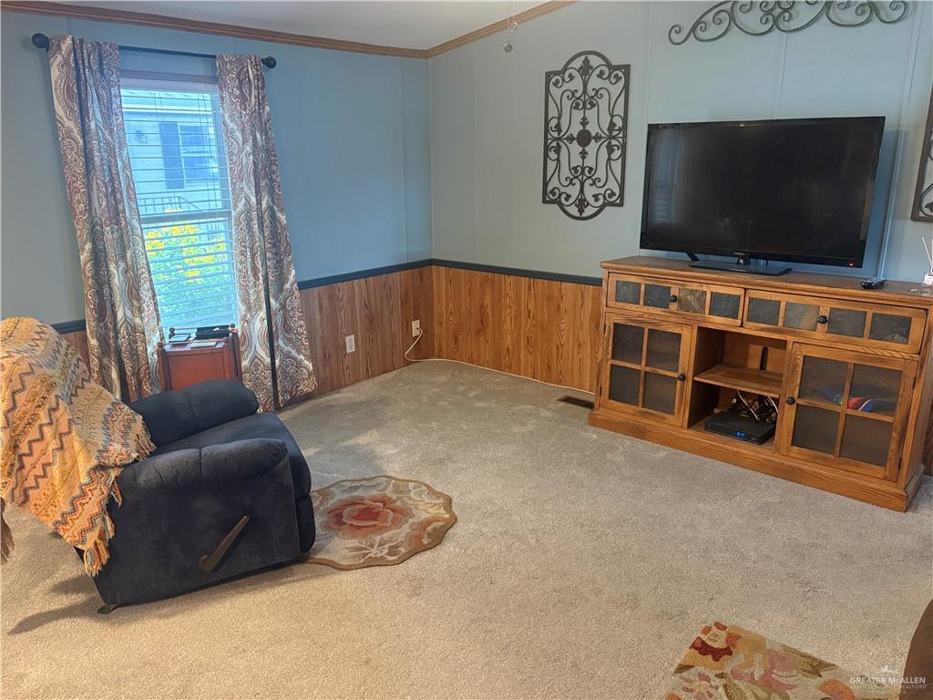 310 Randal Drive, Unit H12 Mission, TX 78572 - Photo 12 of 36 a livingroom with furniture window and a flat screen tv