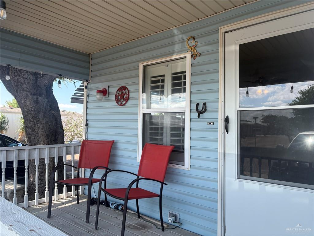 310 Randal Drive, Unit H12 Mission, TX 78572 - Photo 3 of 36 a front view of a house with outdoor seating