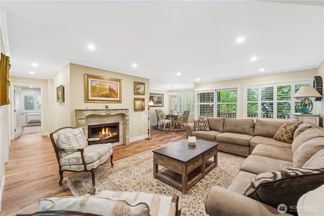 a living room with furniture fireplace and a table