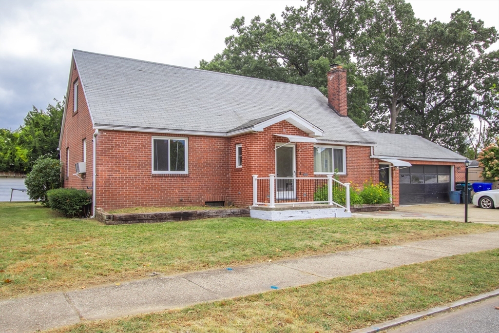 143 Redlands Street Springfield, MA 01104 - Photo 11 of 38 a front view of a house with a yard