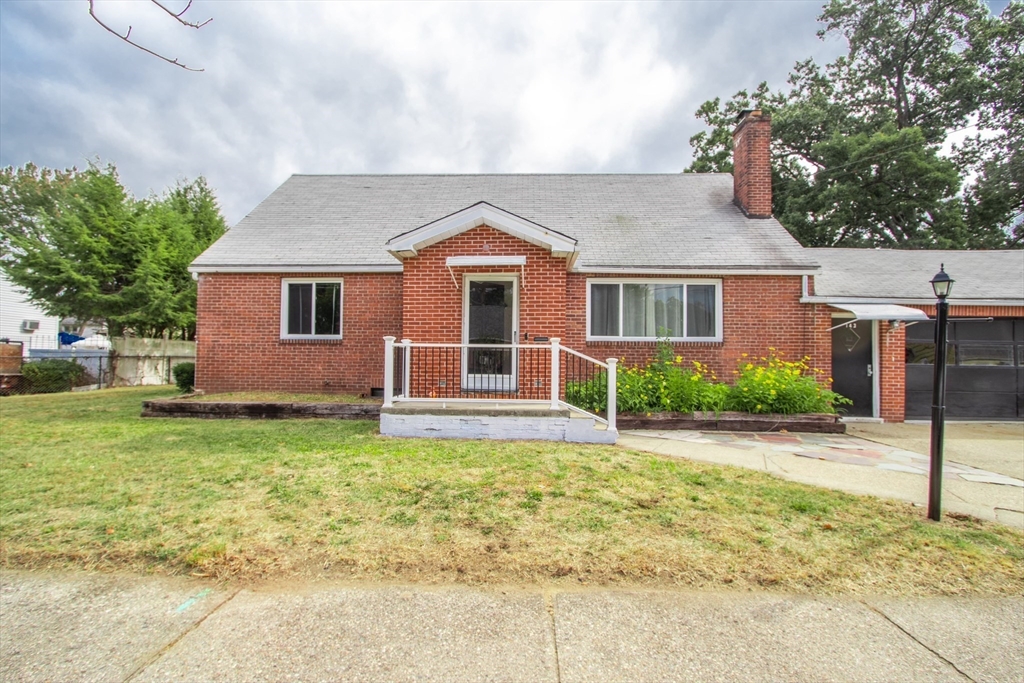 143 Redlands Street Springfield, MA 01104 - Photo 12 of 38 front view of a house with a yard