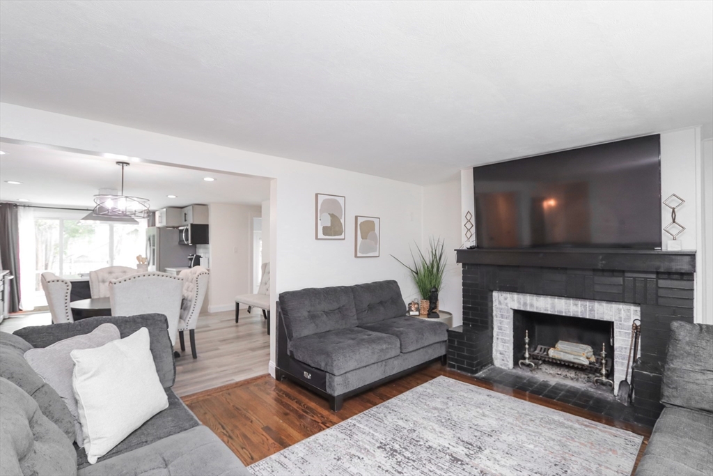 143 Redlands Street Springfield, MA 01104 - Photo 13 of 38 a living room with furniture and a fireplace