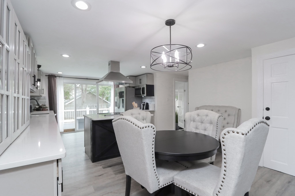 143 Redlands Street Springfield, MA 01104 - Photo 22 of 38 a view of a dining room with furniture wooden floor and chandelier