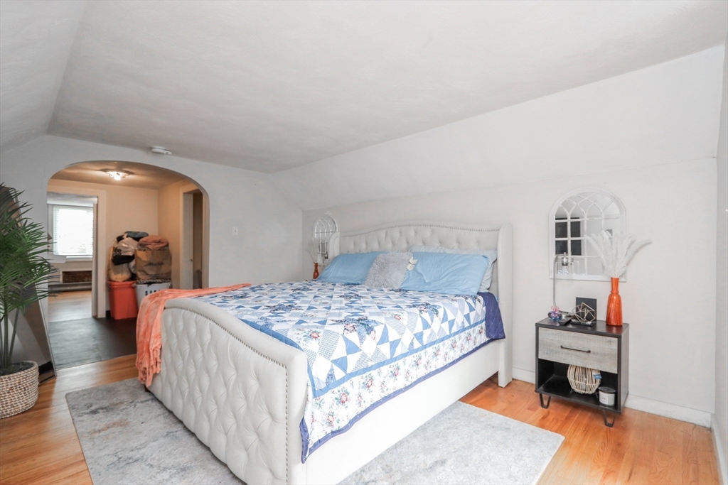 143 Redlands Street Springfield, MA 01104 - Photo 27 of 38 a bedroom with a bed and a couch