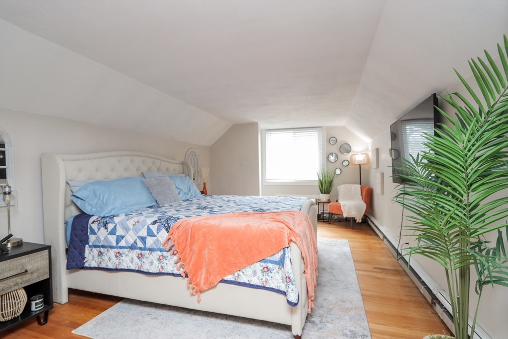 143 Redlands Street Springfield, MA 01104 - Photo 29 of 38 a bedroom with a bed and a couch