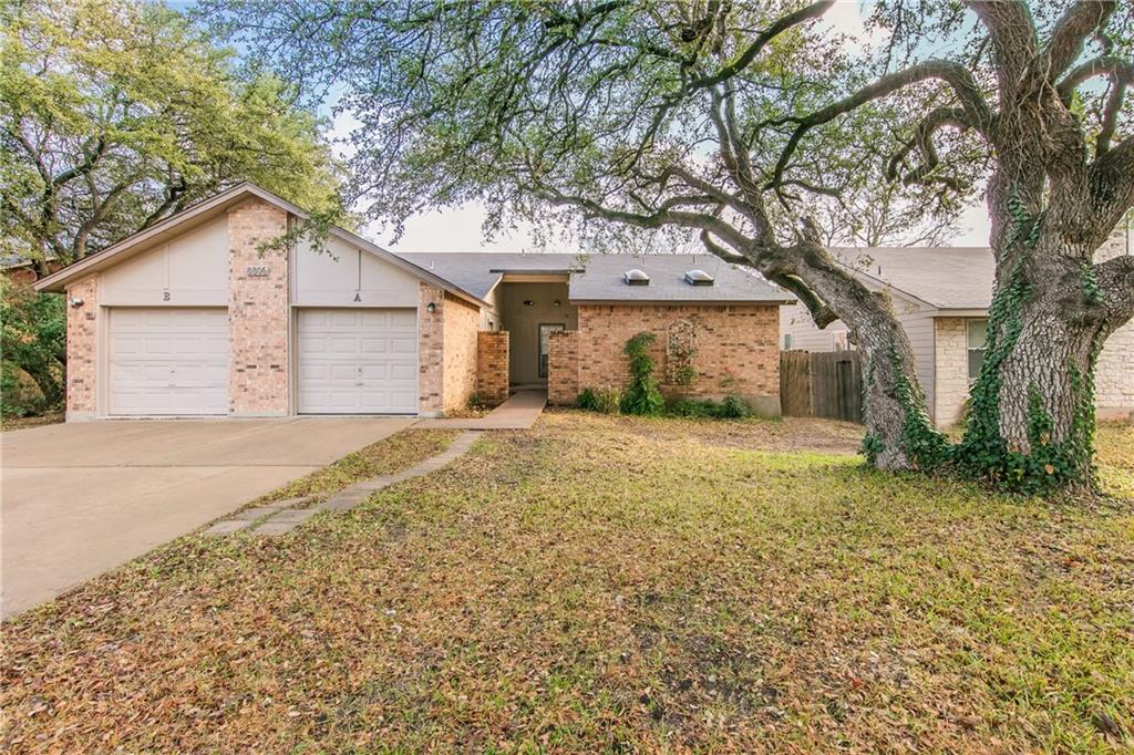 8806 Piney Point Drive, Unit A Austin, TX 78729 - Photo 1 of 1 a house with a tree in front of it