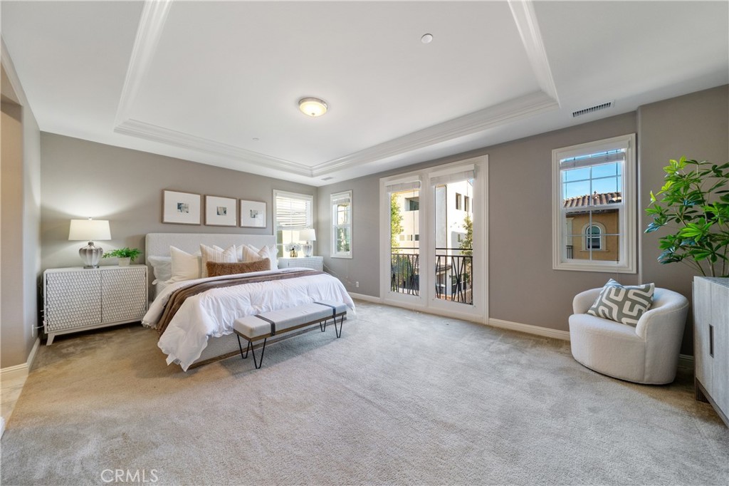 215 Bryce Run Lake Forest, CA 92630 - Photo 12 of 33 a spacious bedroom with a bed and a couch