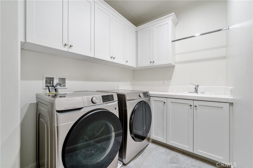215 Bryce Run Lake Forest, CA 92630 - Photo 22 of 33 a utility room with sink dryer and washer