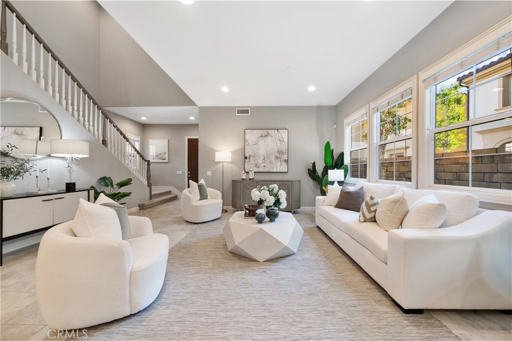 215 Bryce Run Lake Forest, CA 92630 - Photo 3 of 33 a living room with furniture and a large window
