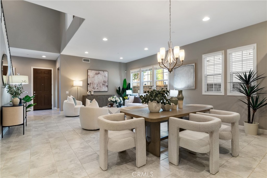 215 Bryce Run Lake Forest, CA 92630 - Photo 6 of 33 a living room with fireplace furniture and a chandelier