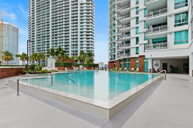 a view of swimming pool with outdoor seating