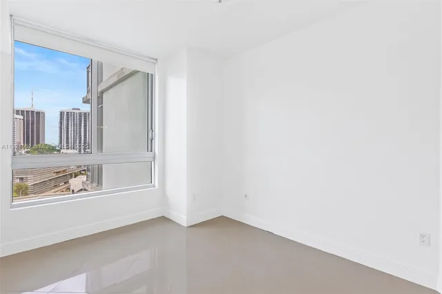 a bathroom with a toilet sink and shower