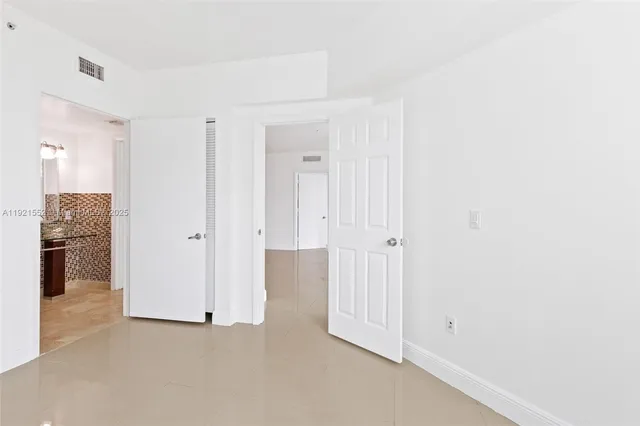 a bathroom with a toilet and shower