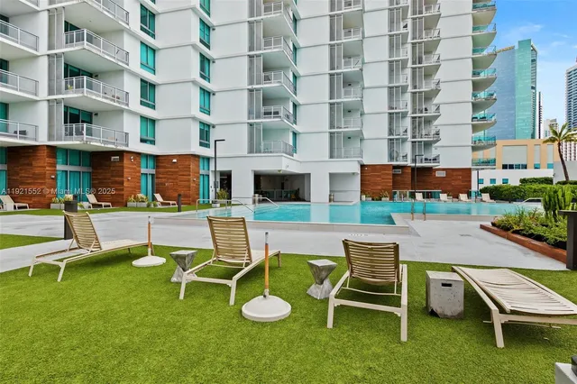 a view of a patio with a table and chairs