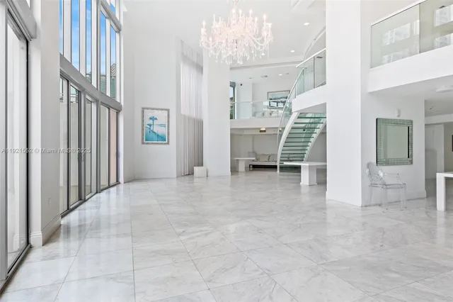 a large living room with lots of furniture and rug