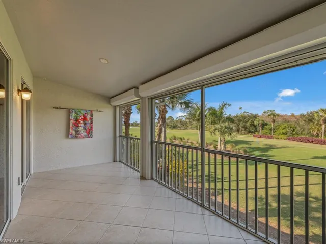 a bathroom with a double vanity sink mirror and chandelier