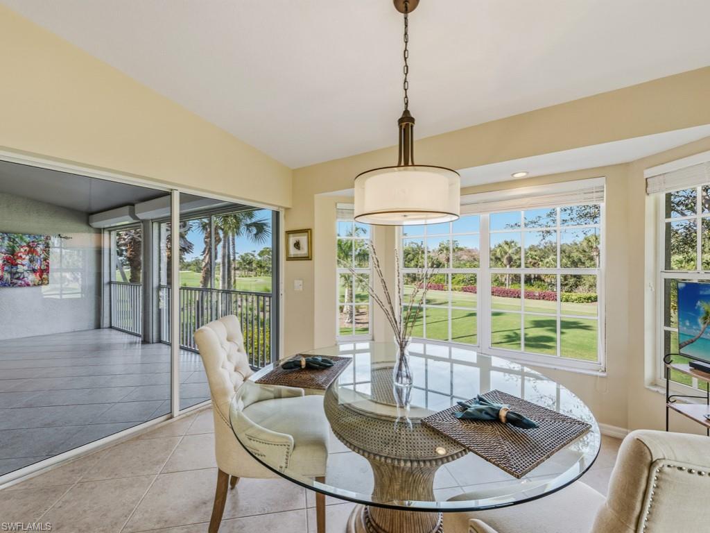 6095 Pinnacle Lane, Unit 1304 Naples, FL 34110 - Photo 9 of 47 a view of a dining room with furniture window and outside view