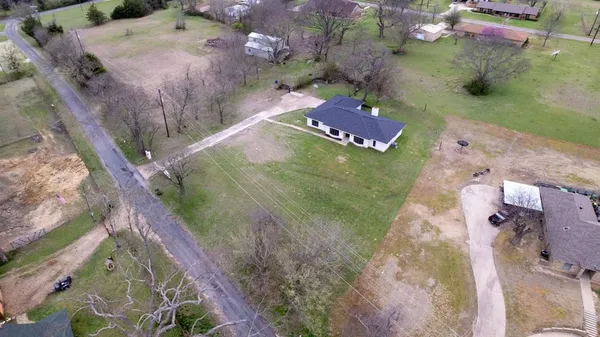 an aerial view of a house a yard