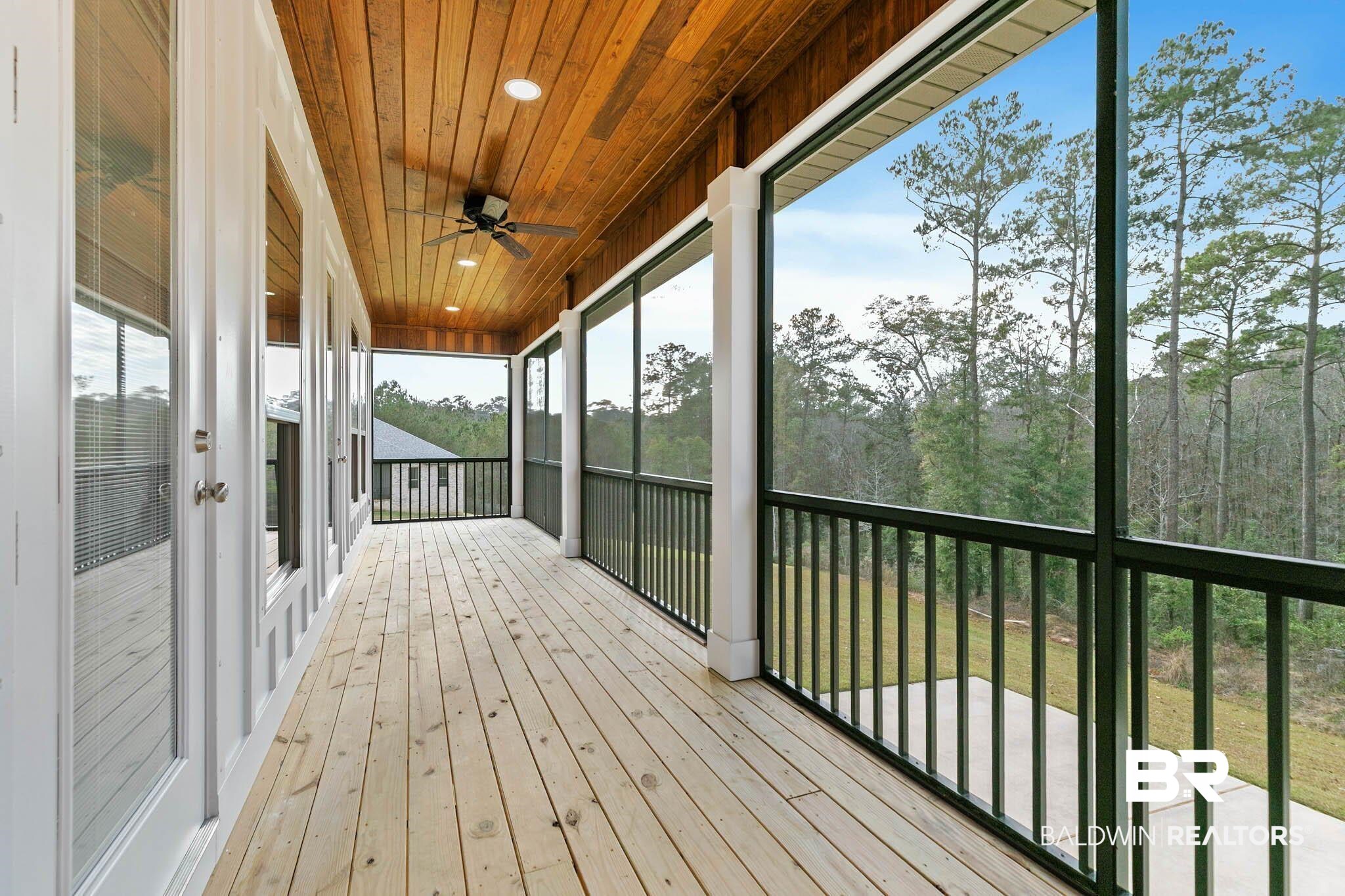 6656 Garrison Drive Daphne, AL 36527 - Photo 27 of 57 Wooden deck with ceiling fan and a sunroom