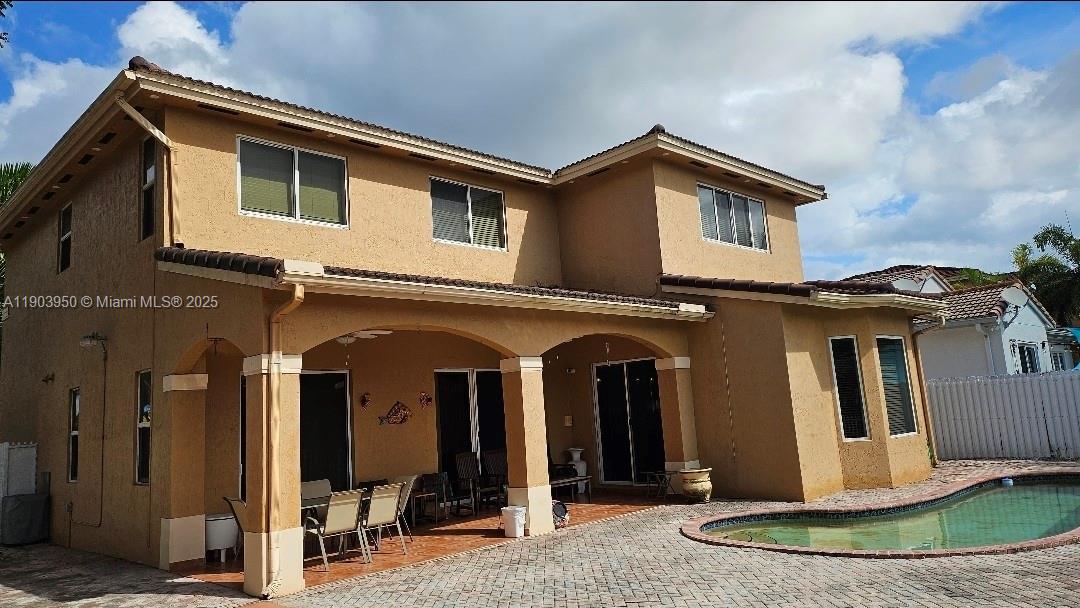 a view of a house with more windows and yard