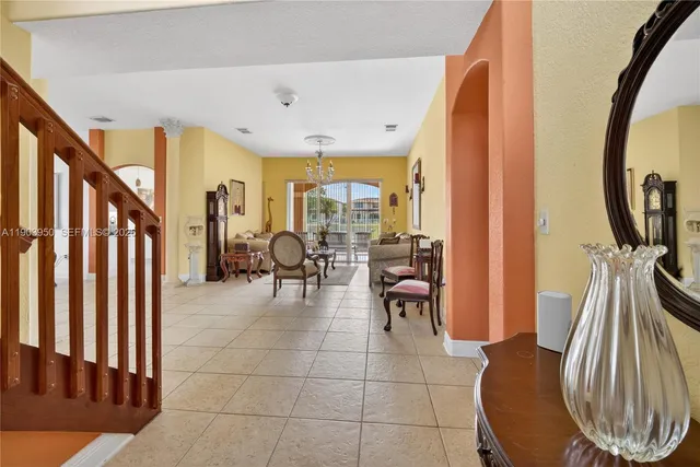 a view of a livingroom with furniture and entryway