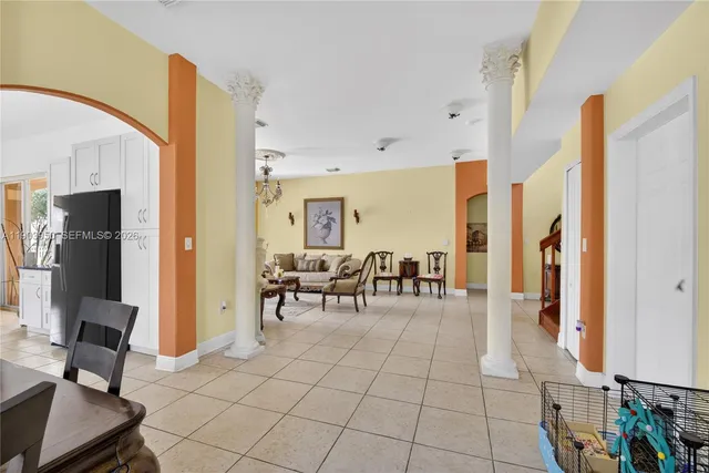 a view of a livingroom with furniture and a flat screen tv
