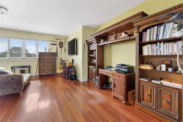 a view of kitchen with furniture and wooden floor