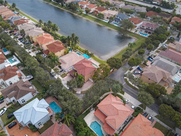 an aerial view of a house with a yard