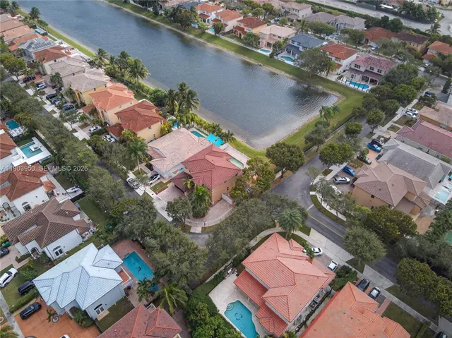 an aerial view of a house with a yard