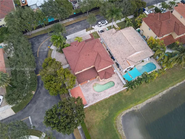 an aerial view of a house with outdoor space