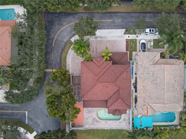 an aerial view of a house with outdoor space