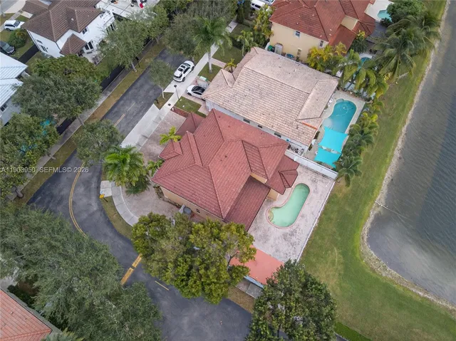 an aerial view of a house with outdoor space
