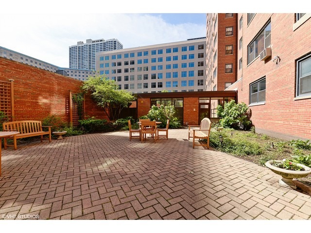 2909 North Sheridan Road, Unit 112 Chicago, IL 60657 - Photo 12 of 12 a building view with outdoor space