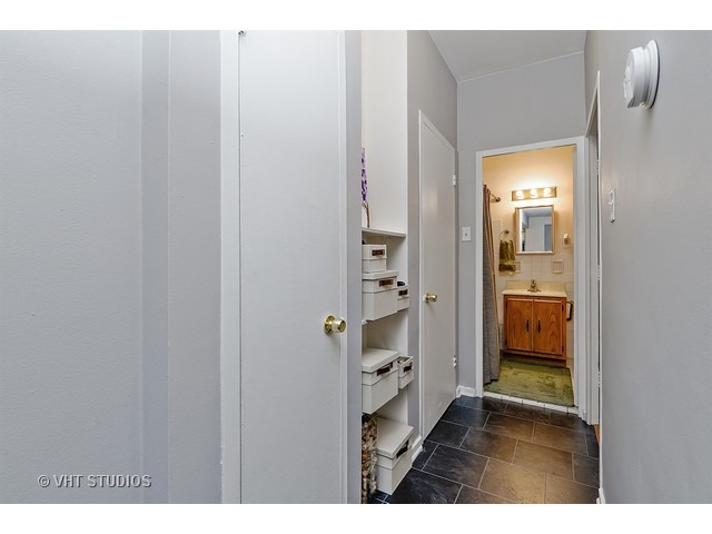 2909 North Sheridan Road, Unit 112 Chicago, IL 60657 - Photo 7 of 12 a bathroom with a sink and a mirror