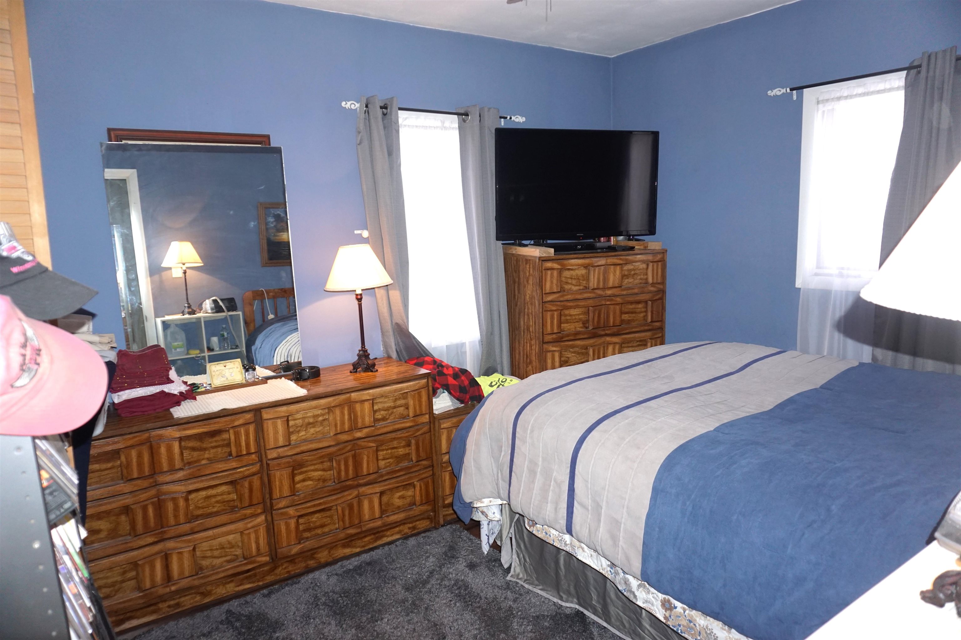 7402 Randy Road Machesney Park, IL 61115 - Photo 13 of 23 a bedroom with a bed and flat screen tv