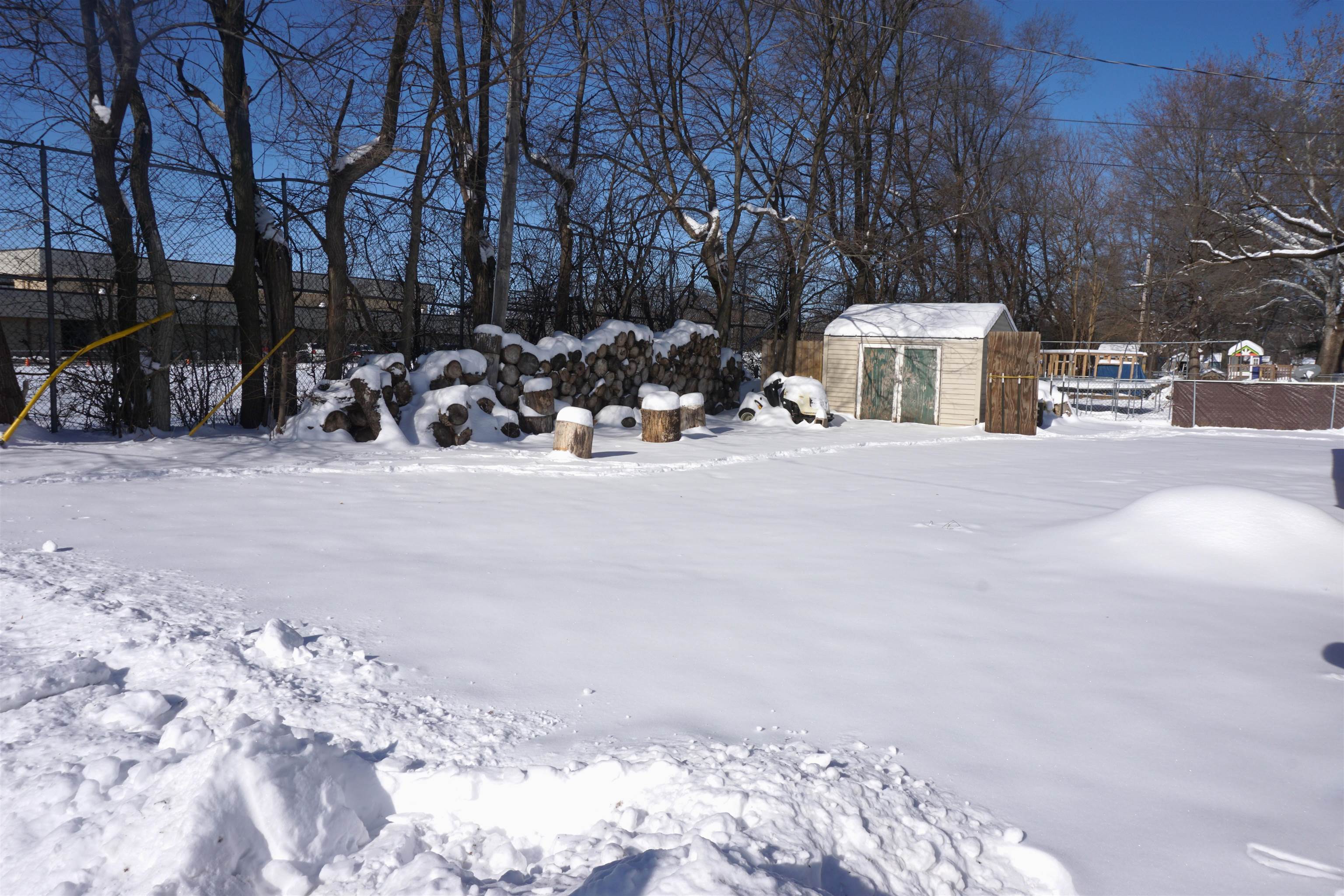 7402 Randy Road Machesney Park, IL 61115 - Photo 19 of 23 a view of a house with snow on the road
